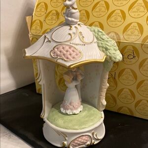 Elegant White and Gold Figurine Carousel